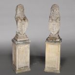A PAIR OF STONE HERALDIC LIONS ON FLUTED RECTANGULAR PLINTHS.