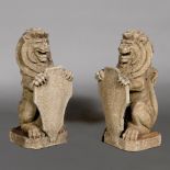 A PAIR OF CAST STONE ARMORIAL LIONS.