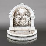 A LARGE MARBLE COMPOSITE WALL BACKED FOUNTAIN.