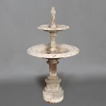 A CAST IRON TWO TIER WATER FOUNTAIN.