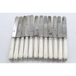 A SET OF TWELVE GEORGE III TABLE KNIVES. with fluted handles (loaded) and steel blades, by Moses