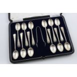 A GEORGE V CASED SET OF TEASPOONS AND MATCHING PAIR OF SUGAR TONGS. by John Sanderson & Son Ltd,