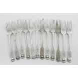 A SET OF TWELVE GEORGE III IRISH FIDDLE AND SHELL DESSERT FORKS. crested, by Richard Whitford (