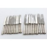 A SET OF TWELVE GEORGE V TABLE KNIVES AND SIDE KNIVES. with ribbon read borders and stainless