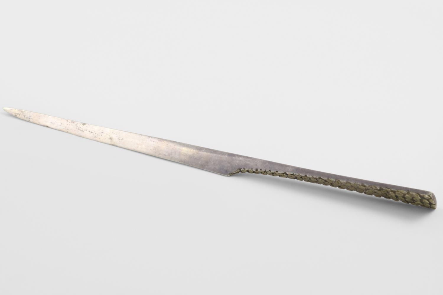 BY STUART DEVLIN:-. an Elizabeth II parcel-gilt paper knife, with a textured handle and inscribed "