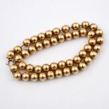 A SINGLE ROW UNIFORM GOLD BEAD NECKLACE. 39cm long, 29 grams. **BP 22.5% inc VAT + Lot Fee of £8