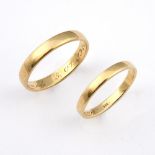 A GENTLEMAN'S 14CT GOLD WEDDING BAND. 5.3 grams, size Z 1/2, together with another 14ct gold wedding