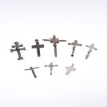 A QUANTITY OF EARLY PECTORAL CRUCIFORM PENDANTS. all depicting Christ on the Cross, metal. **BP 22.