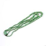 A TWO ROW GRADUATED JADE BEAD NECKLACE. the jade beads graduate from approximately 4.1 to 9.8mm to