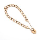 A 9CT GOLD OVAL LINK BRACELET. with padlock claps, each link stamped 375, 19.5cm long, 17.3