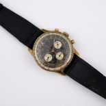 A GOLD PLATED AND STAINLESS STEEL NAVITIMER COSMONAUTE WRISTWATCH BY BREITLING. signed circular