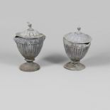 A PAIR OF LEAD GARDEN URNS AND COVERS. of fluted form with swag and mask decoration, the covers with