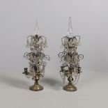 A PAIR OF FRENCH TABLE CANDELABRA. with brass bases and cut glass stems supporting scrolling