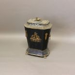 A TOLEWARE COAL BIN. the cover with brass sphinx form handle, further brass detailing and claw feet,