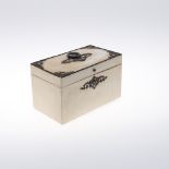 A FRENCH CREAM LACQUERED TEA CADDY. early 19th century, with cut steel mounts and twin lidded