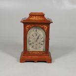 AN EARLY 20TH CENTURY INLAID MAHOGANY BRACKET CLOCK. the 6" silvered and foliate engraved dial