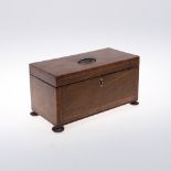 A REGENCY MAHOGANY TEA CADDY. with boxwood and crossbanded inlay, the interior with twin lidded