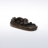 AFTER JAMES PRADIER. a brown patinated bronze study of a nude lying to one side, on an oval base