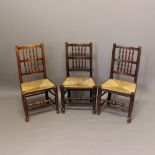 A SET OF SIX ASH SPINDLE BACK RUSH SEATED DINING CHAIRS. late 18th or early 19th century, with two