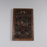 A CARVED OAK PANEL. possibly late 17th century, depicting a bust of an Emperor or King with laurel