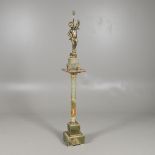 A GILT METAL CHERUB TABLE LAMP. early 20th century, on an onyx base and gilt mounted onyx column,