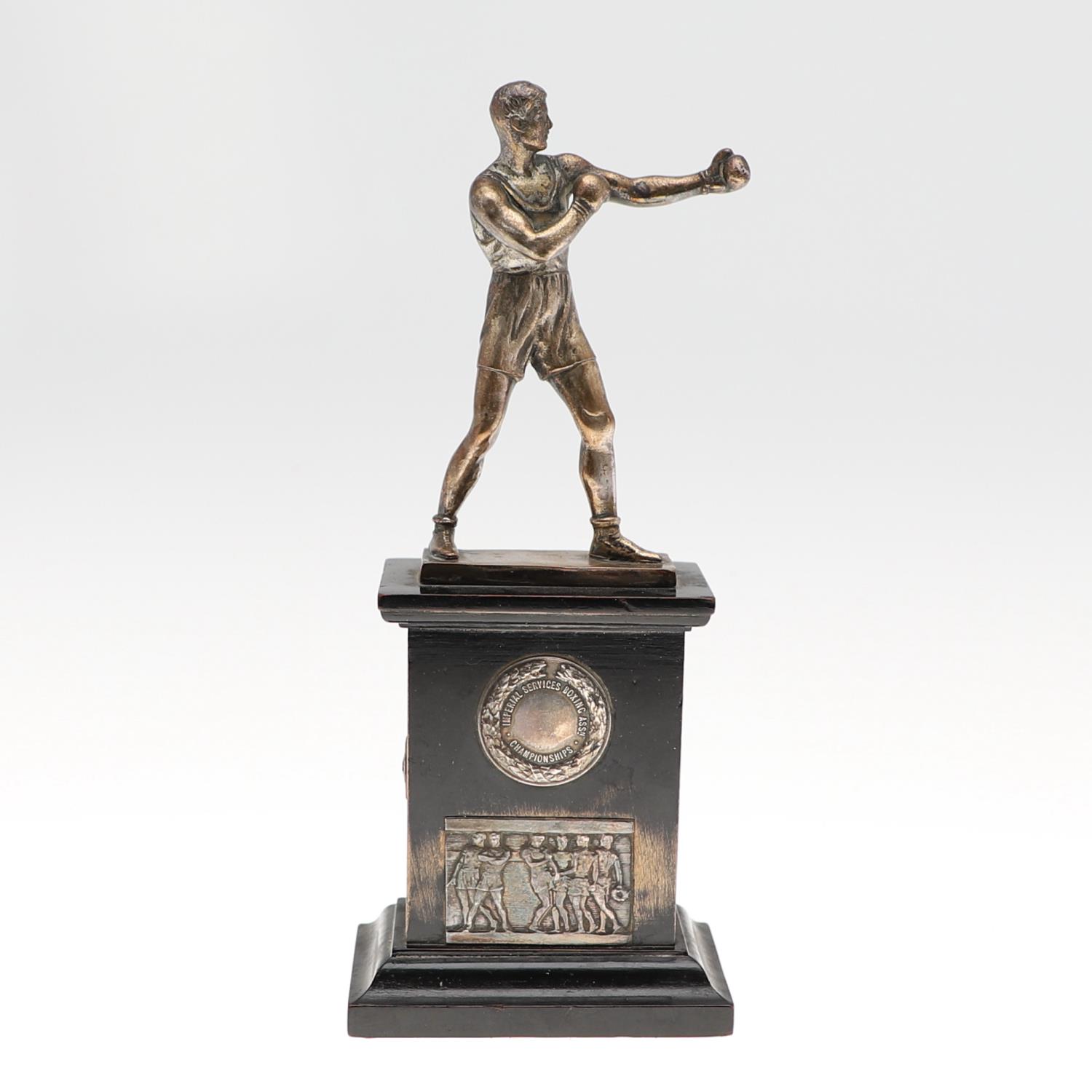 AN INTER-SERVICES BOXING TROPHY.