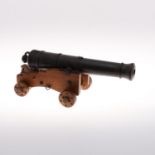 A MODEL OF A NINETEENTH CENTURY 32 POUNDER CANNON.