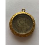 A GEORGE II SIXPENCE IN GILT FOB MOUNT.