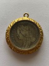 A GEORGE II SIXPENCE IN GILT FOB MOUNT.