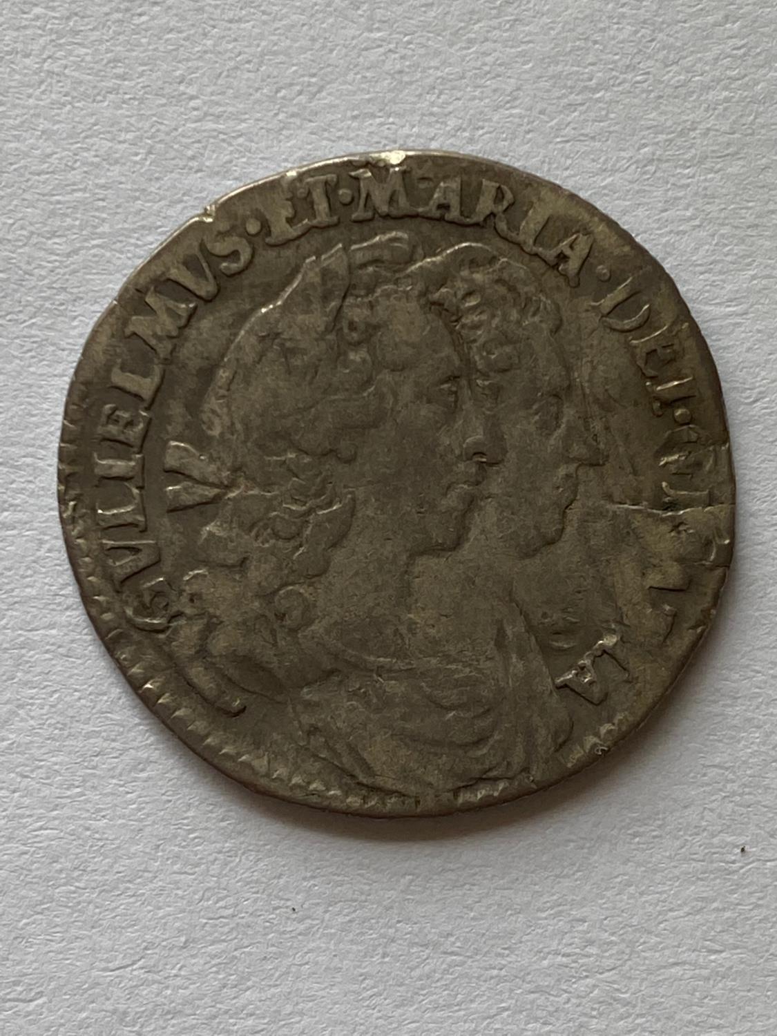 A WILLIAM AND MARY SIXPENCE.