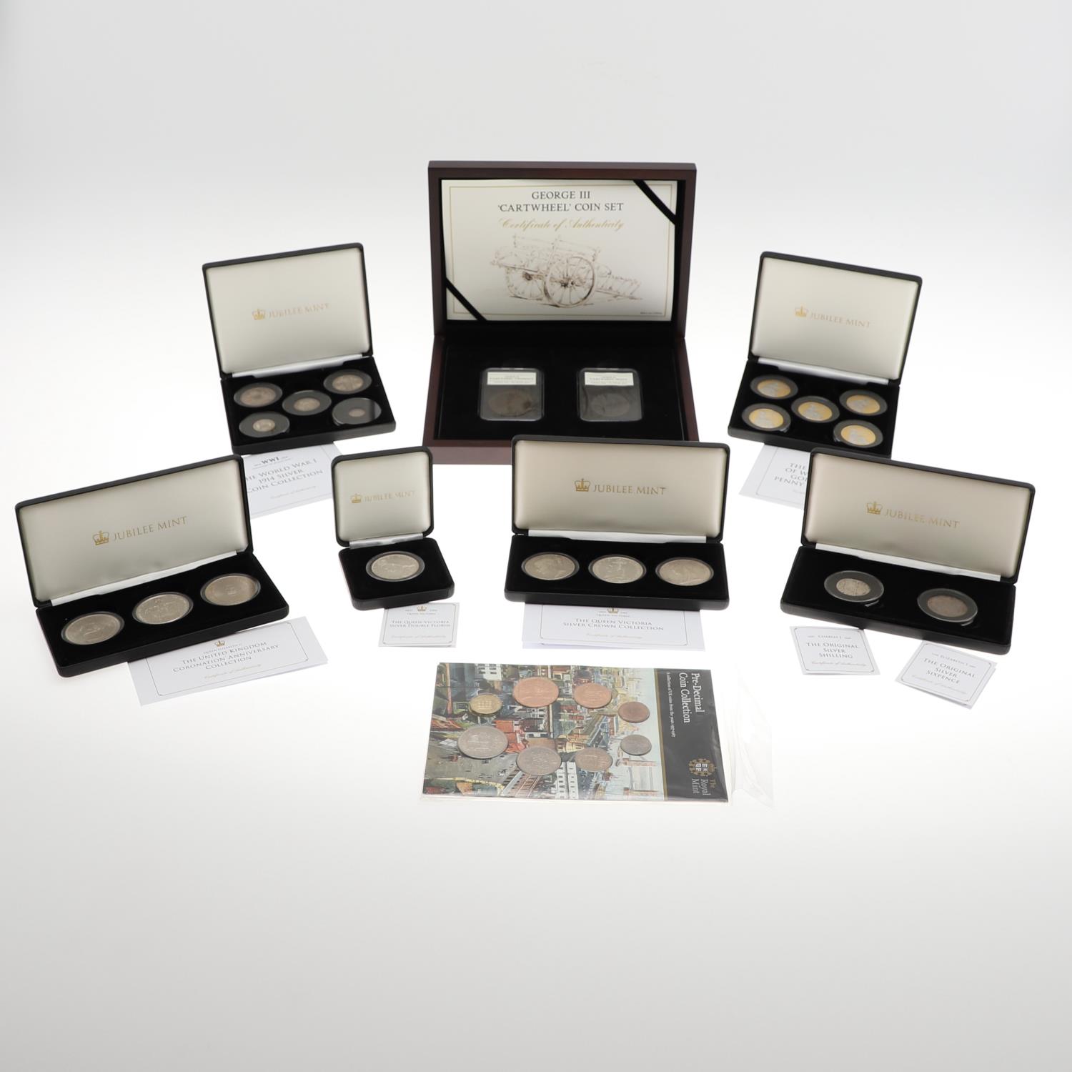 A COLLECTION OF JUBILEE MINT AND OTHER SETS OF PRE-DECIMAL COINS IN PRESENTATION CASES.