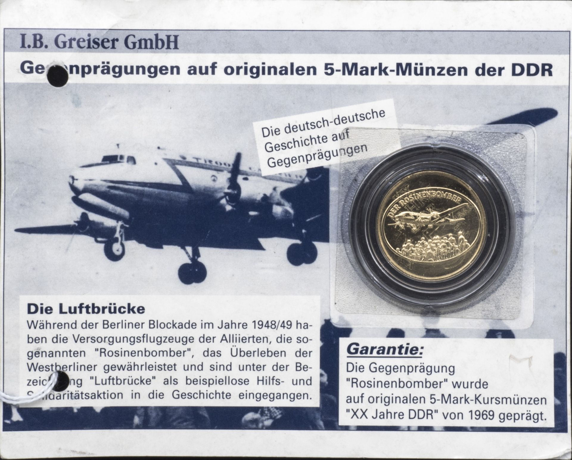 DDR, Rosinenbomber - Gegenprägung auf original 5.- Mark - Münze von 1969. In Kapsel, stgl.