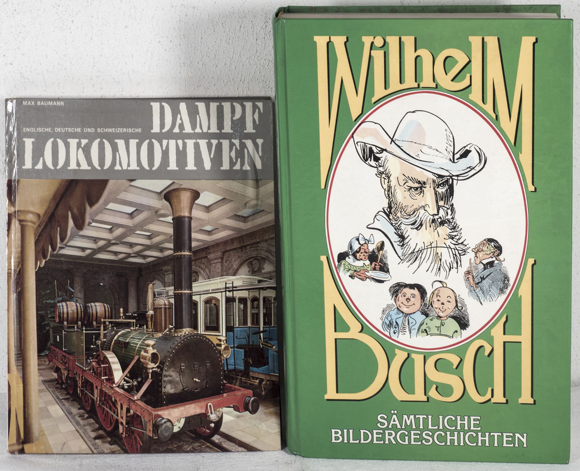 Zwei Bücher: 1. Wilhelm Busch "sämtliche Bildergeschichten" und Max Baumann "Dampflokomotiven".