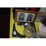 TWO BLACK PAINTED CAST METAL BRACKETS, A PIERCED BRASS TRIVET, AND A GILT FRAMED PRINT DEPICTING