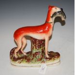 A 19TH CENTURY STAFFORDSHIRE FIGURE OF GREYHOUND AND HARE, 28CM HIGH