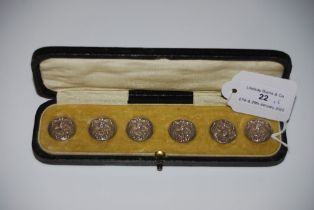 CASED SET OF SIX BIRMINGHAM SILVER CIRCULAR BUTTONS, WITH EMBOSSED DECORATION OF ART NOUVEAU