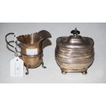 LONDON SILVER CREAM JUG ON THREE PAD FEET, TOGETHER WITH A SHEFFIELD SILVER OVAL SHAPED TEA CADDY