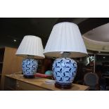 PAIR OF CONTEMPORARY BLUE AND WHITE CERAMIC TABLE LAMPS AND SHADES.