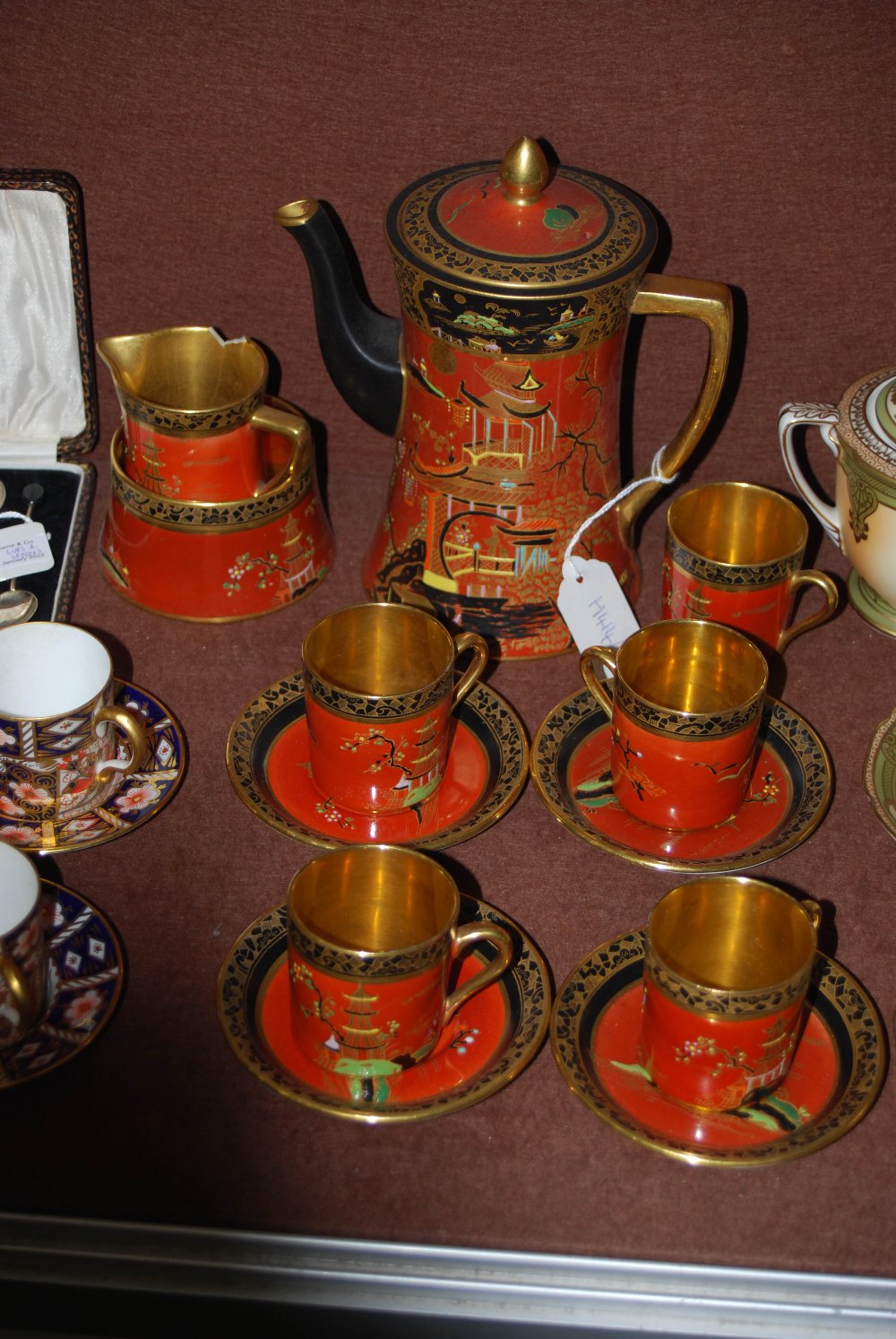 CARLTON WARE ORANGE GROUND CHINOISERIE DECORATED PART COFFEE SET.