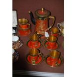 CARLTON WARE ORANGE GROUND CHINOISERIE DECORATED PART COFFEE SET.