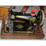 VINTAGE SINGER SEWING MACHINE IN OAK CASE.