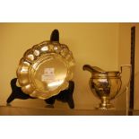 BIRMINGHAM SILVER STRAWBERRY DISH, TOGETHER WITH A BIRMINGHAM SILVER CREAM JUG.