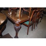 LATE 19TH CENTURY MAHOGANY EXTENDING DINING TABLE ENCLOSING ONE ADDITIONAL LEAF, TOGETHER WITH SIX