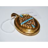VICTORIAN YELLOW METAL, TURQUOISE AND PEARL SET OVAL SHAPED LOCKET, THE COVER WITH STYLISED ATHENIAN