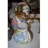 THREE PIECES OF ART DECO POOLE FLORAL WARE INCLUDING A VASE (SHAPE 442), A JUG (MODEL 604) AND A
