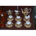 NORITAKE IVORY GROUND COFFEE SET WITH GILDED FLORAL DETAIL.