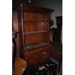 EARLY 20TH CENTURY OAK BOOKCASE, THE THREE TIER SHELVED TOP ABOVE A BASE SECTION WITH SINGLE