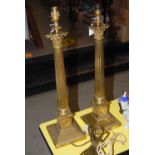 PAIR OF EARLY 20TH CENTURY BRASS CORINTHIAN COLUMN TABLE LAMPS, EACH WITH FLUTED COLUMNS ON