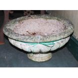 A 20TH CENTURY CAST CONCRETE GARDEN URN OF LOW FORM WITH WIDE LOBED BODY ON A ROUND SOCLE BASE, 49CM