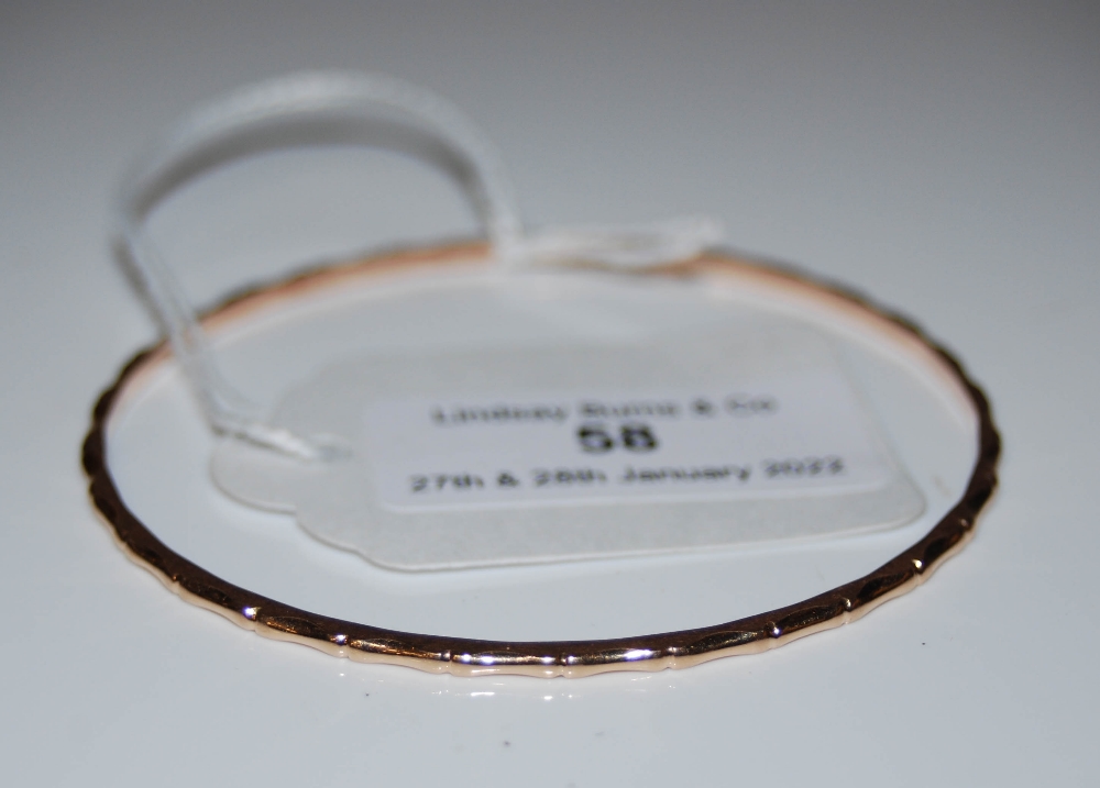 A 9CT GOLD BANGLE, 6.9 GRAMS.